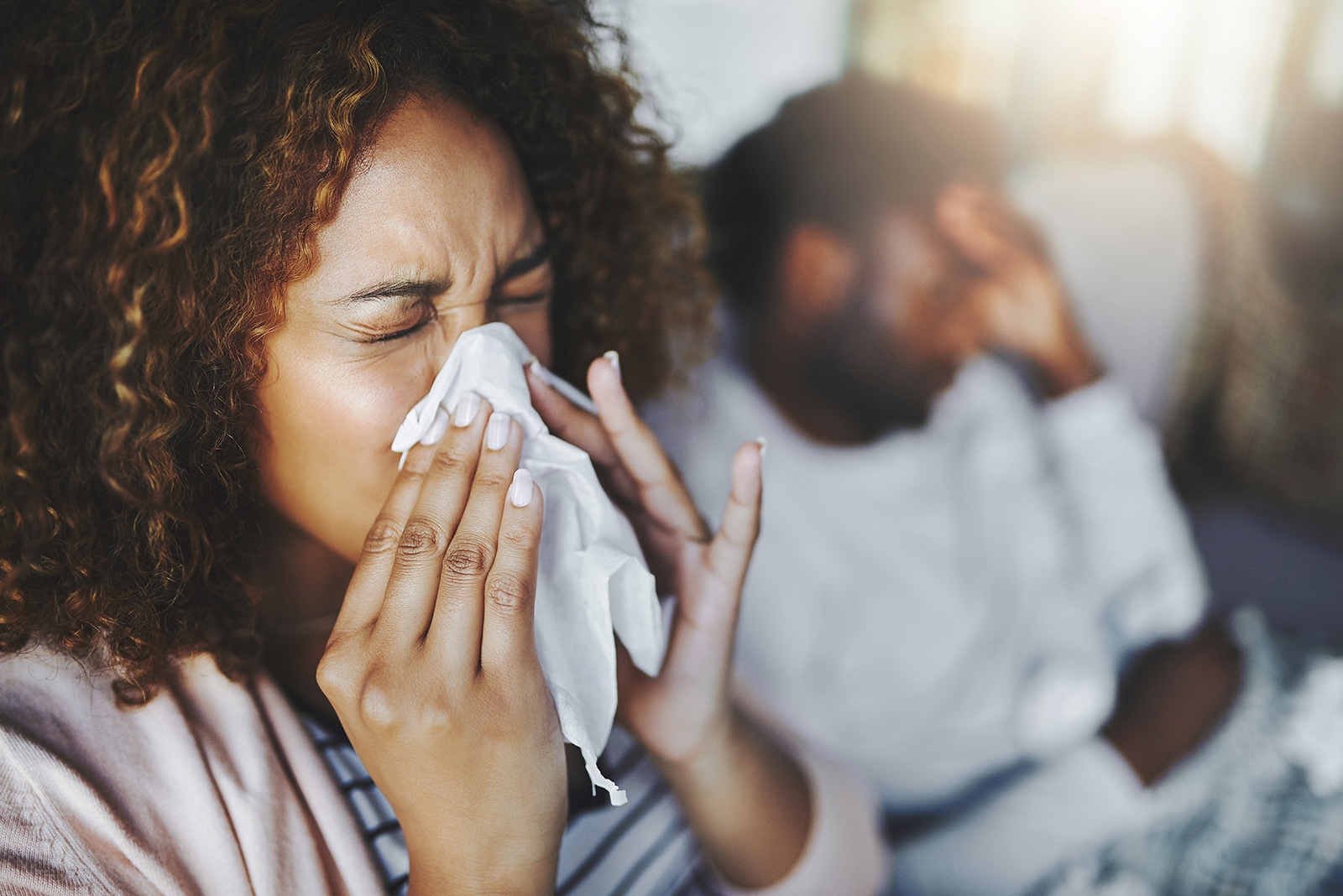 Woman sneezing